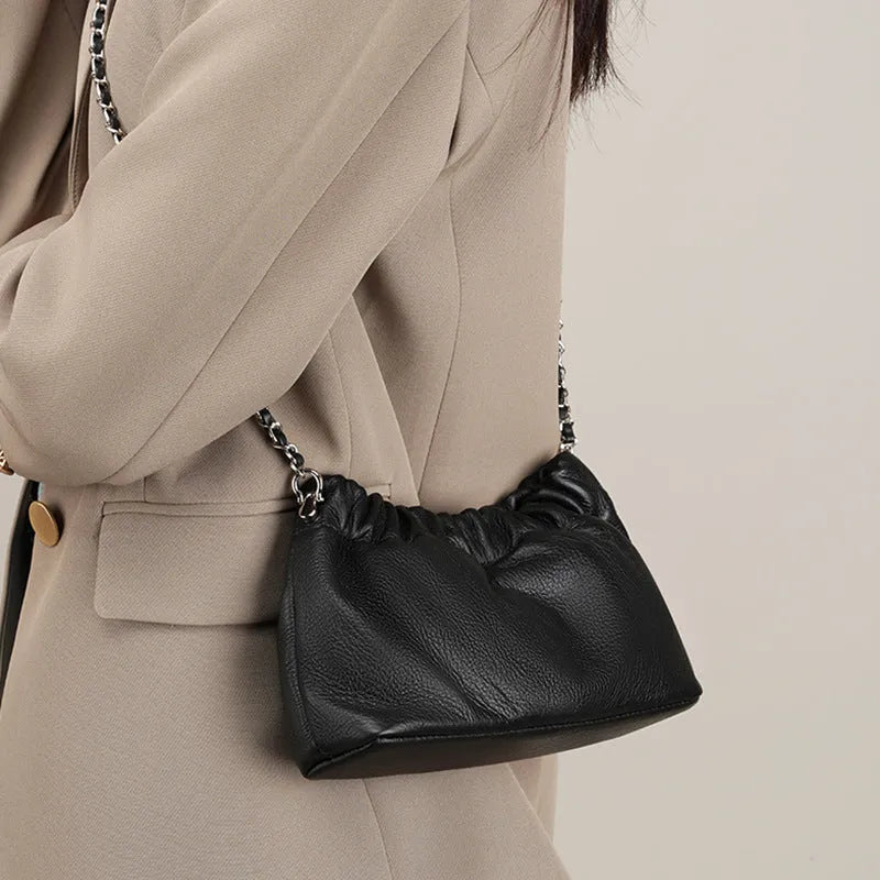 Women's soft leather dumpling-shaped crossbody bag in grey with a single strap
