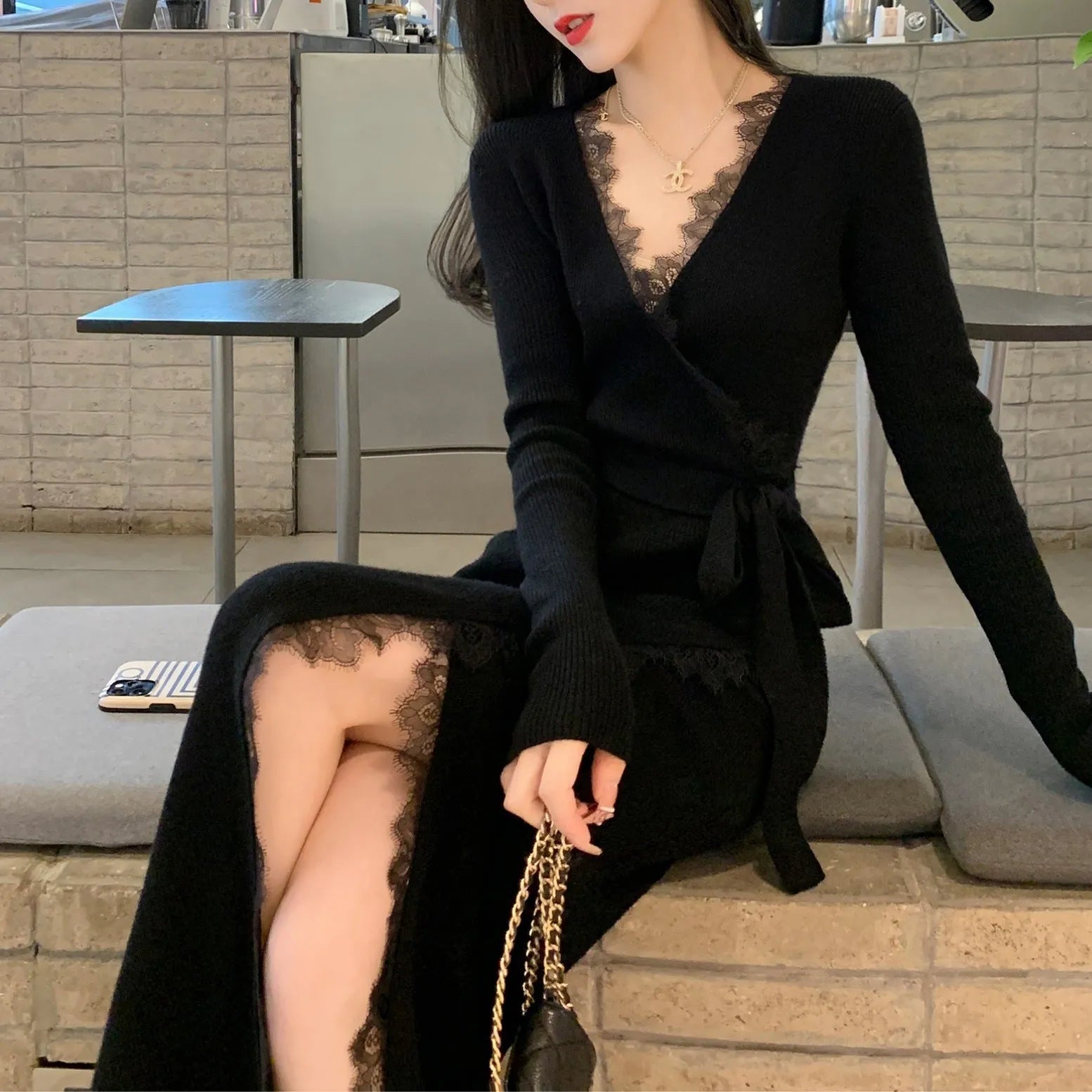 Black women's slim fit woolen princess dress skirt on a model.
