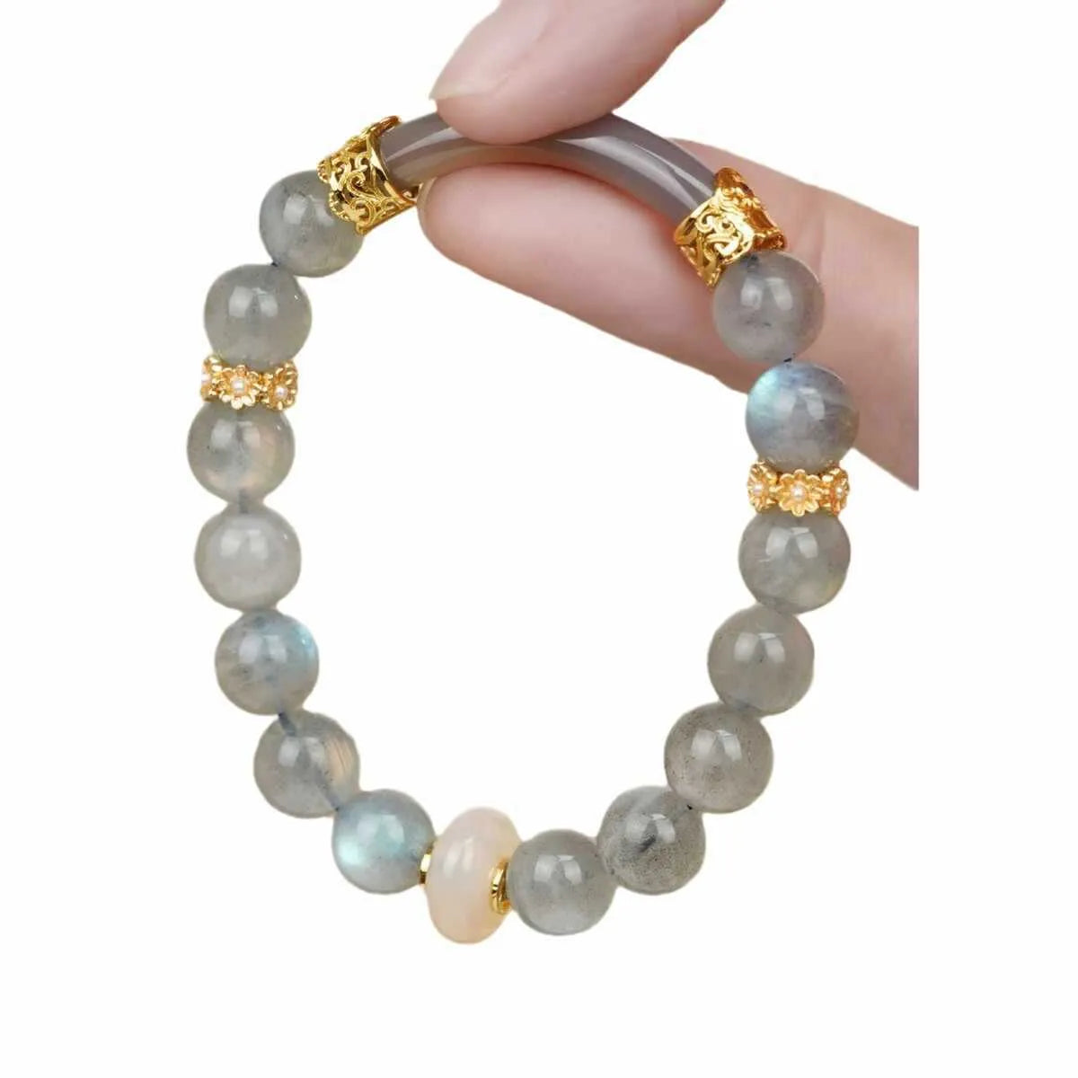 Grey moonstone bracelet with 8mm round beads on a wrist.