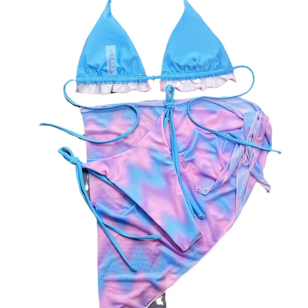 Women's tie-dye patterned bikini swimsuit set with bra, panties, and skirt.
