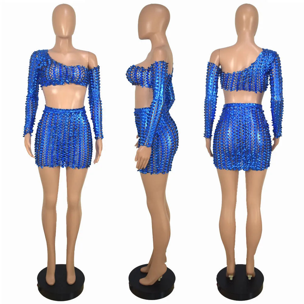 Women's black hollow-out two-piece dress set with net hole pattern showing sleeveless top and short skirt
