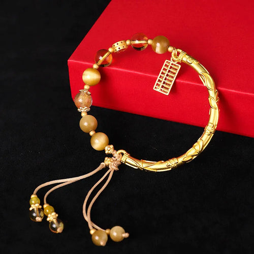 Women's tigereye and citrine abacus bracelet with diamond-shaped design and copper fastenings