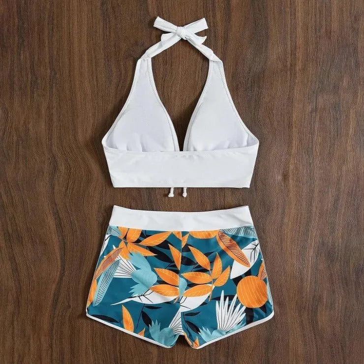 Women's solid colour white split top swimsuit with leaf print boxers bottoms, backless, sleeveless, polyester fabric