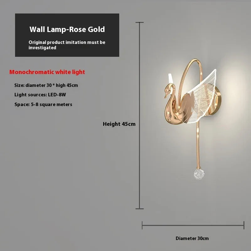 Minimalist swan-shaped wall lamp with gold finish and white acrylic shade.