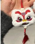 Blue and yellow handmade plush lion keychain ornament with tassel and star stone decoration.