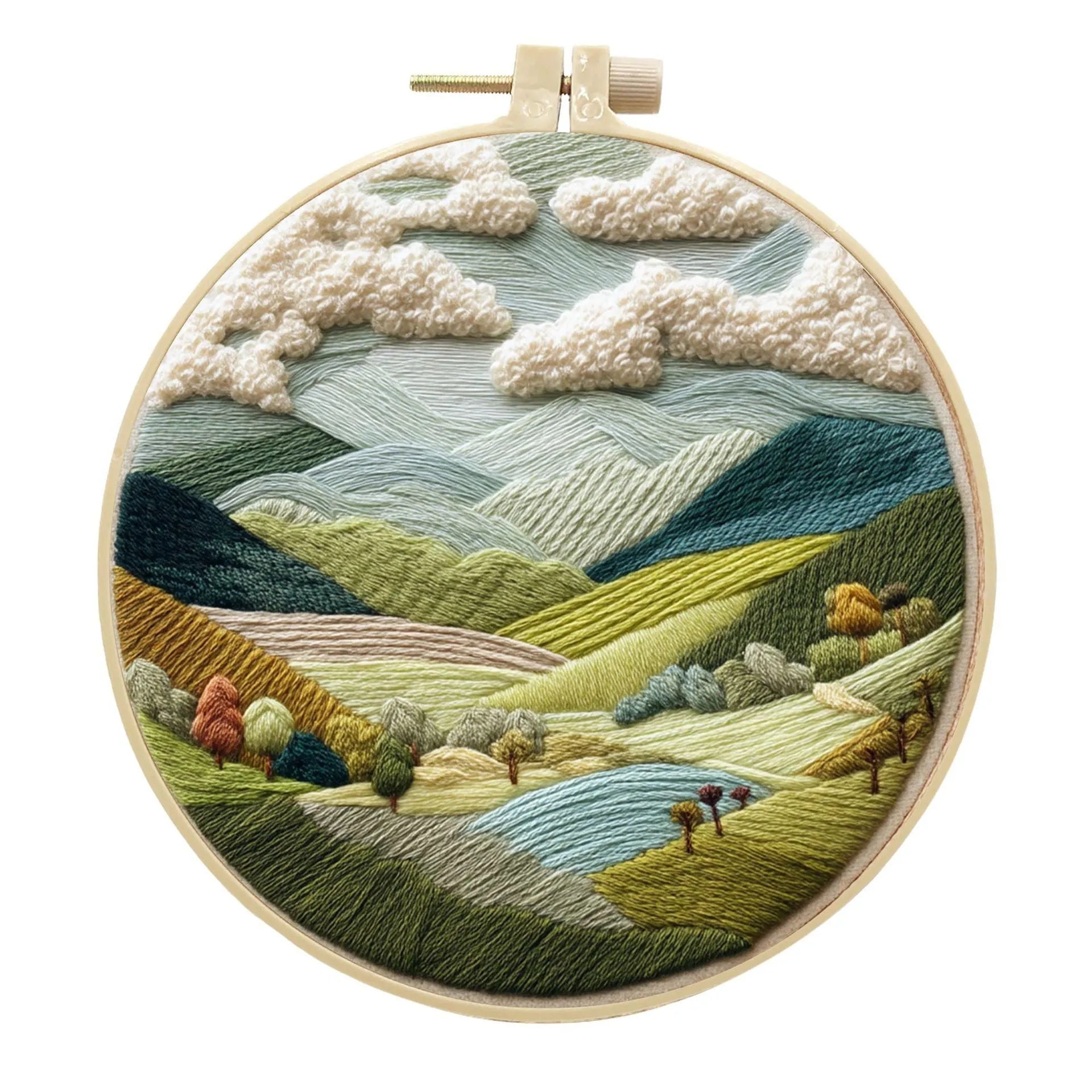 Embroidery DIY kit with cotton fabric, bamboo frame, scissors, and printed landscape pattern