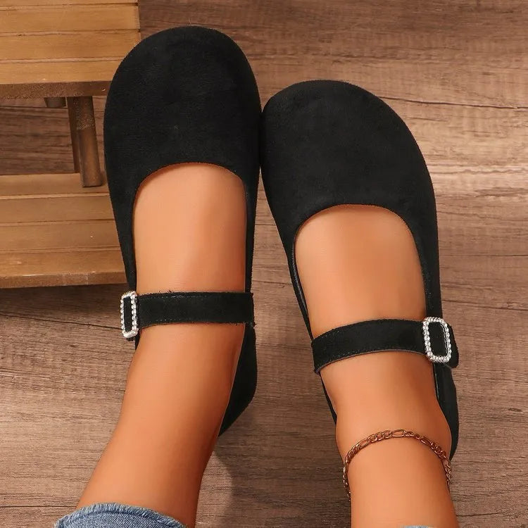 Black canvas fisherman shoes with flat rubber soles shown in adult sizes