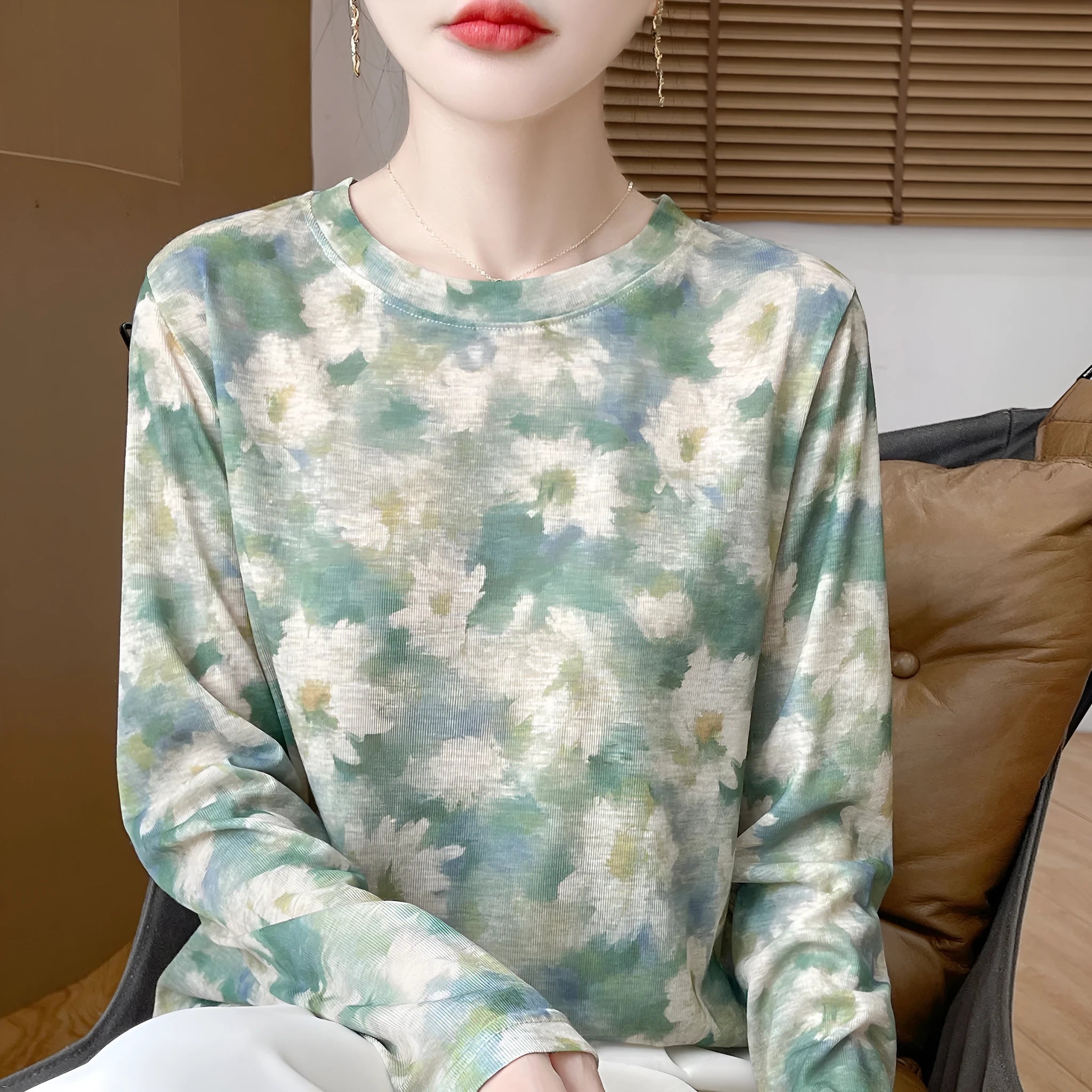 Women's round neck floral print pullover shirt in Tencel cotton fabric on a model.