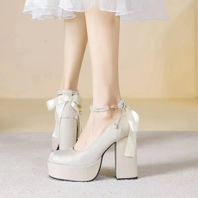 Women's beige waterproof platform wedding shoes with a thick chunky heel and buckle fastening