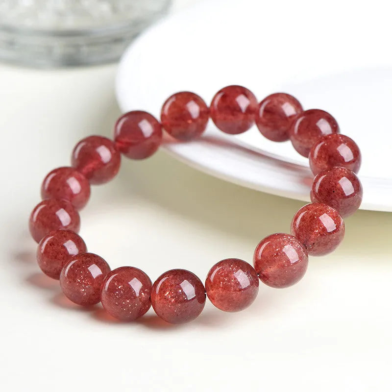 Natural cherry red strawberry quartz bracelet with polished geometry beads and starlight effect