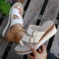 White patent leather wedge sandals with woven finger-fit straps and a peep toe design on a rubber sole.
