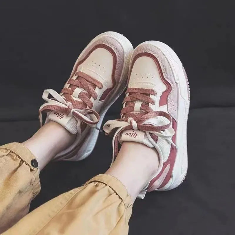 Spring low-top sneakers with rubber sole in beige and pink colour options on a white background
