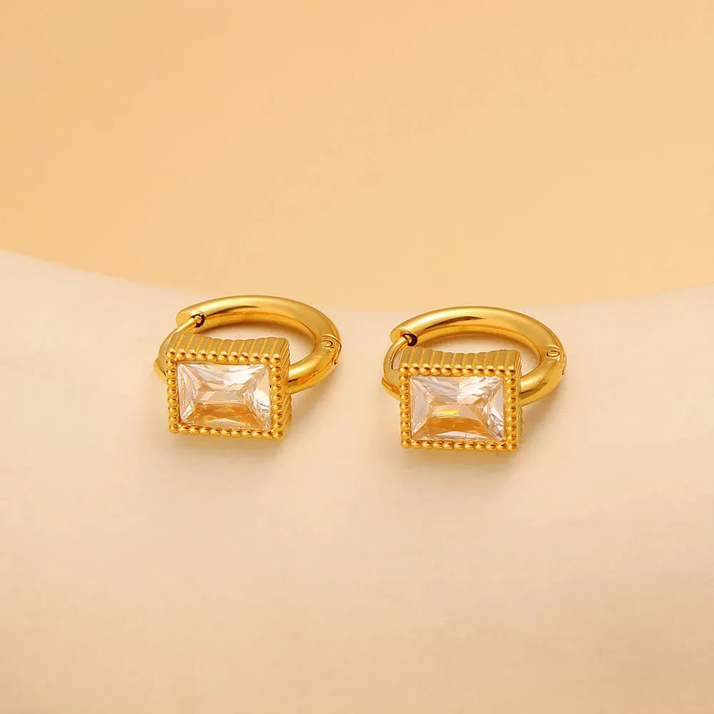 A pair of square geometric zircon stainless steel earrings on a white background.