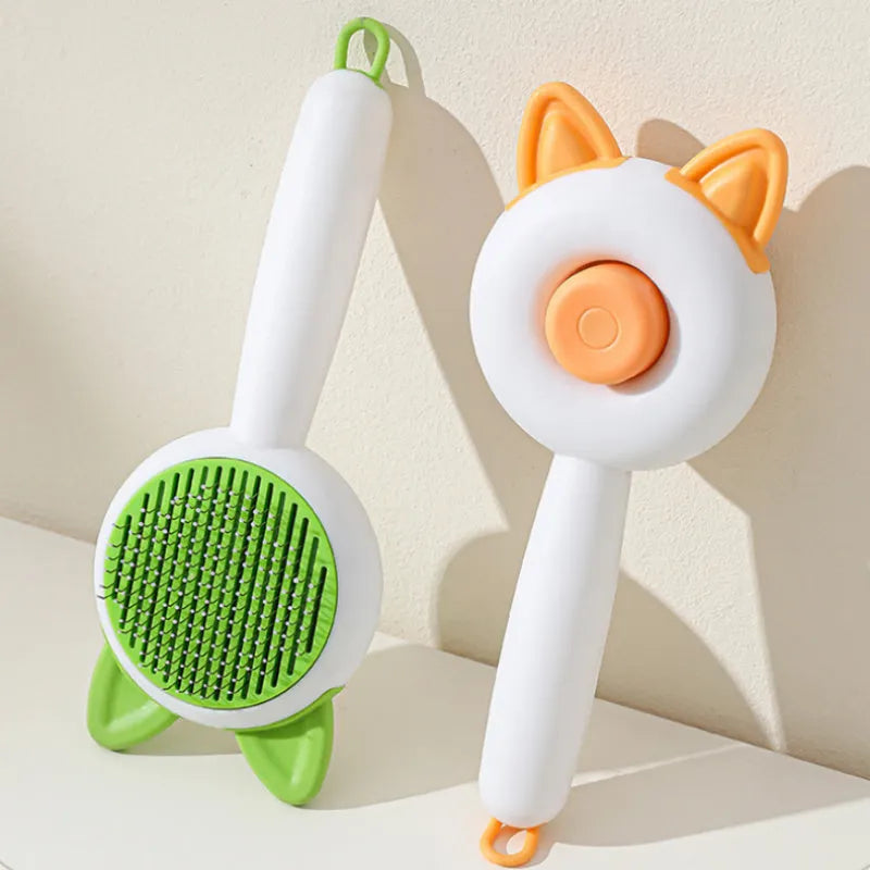 Self-cleaning pet grooming comb with massage function in greenish white or orange white colour options