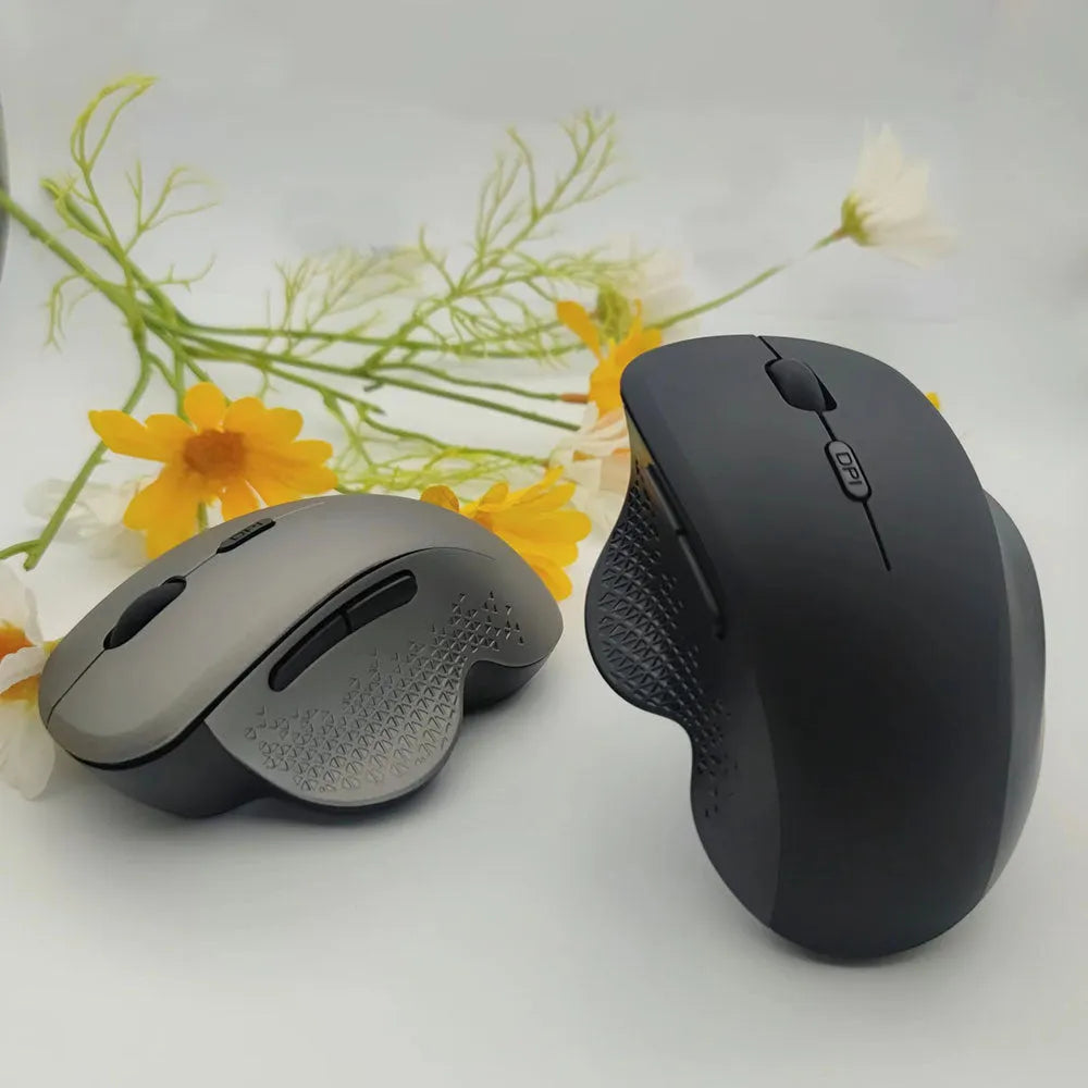 Self-charging wireless mouse for laptop computers in black or grey colour with USB charging cable