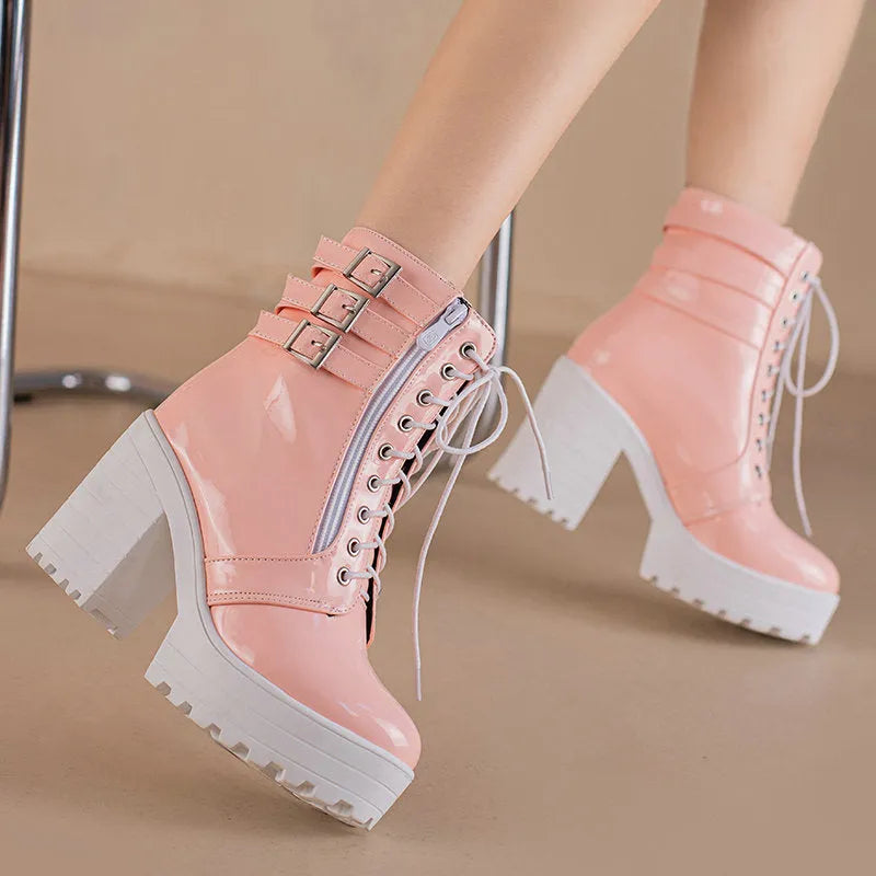 Women's black thick-heeled lace-up ankle boots with a round toe and waterproof platform sole.