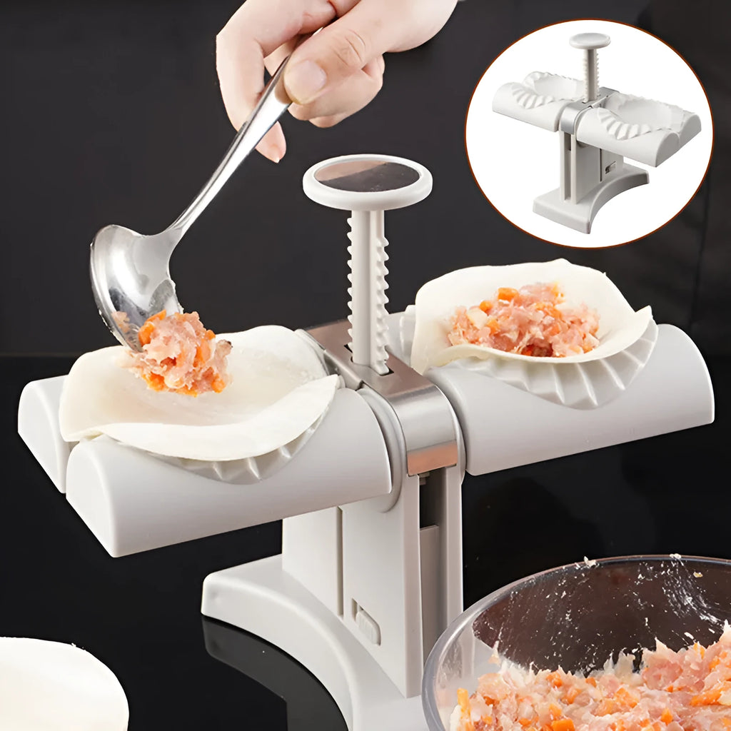 White double-head manual dumpling mould with stainless steel and plastic construction on a rubber anti-slip mat.