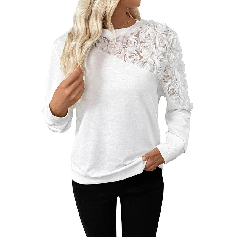 White floral print long sleeve women's pullover top with a loose fit.