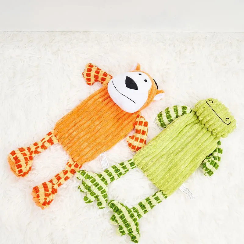 Green and orange plush dog toy with immortal squeaker for aggressive chewers