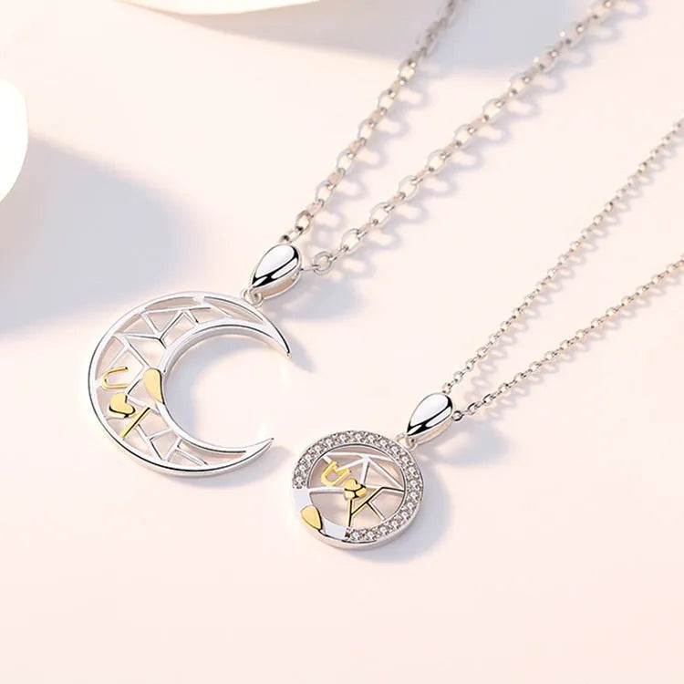 Copper sun and moon couple necklace with electroplated finish on a cross chain.
