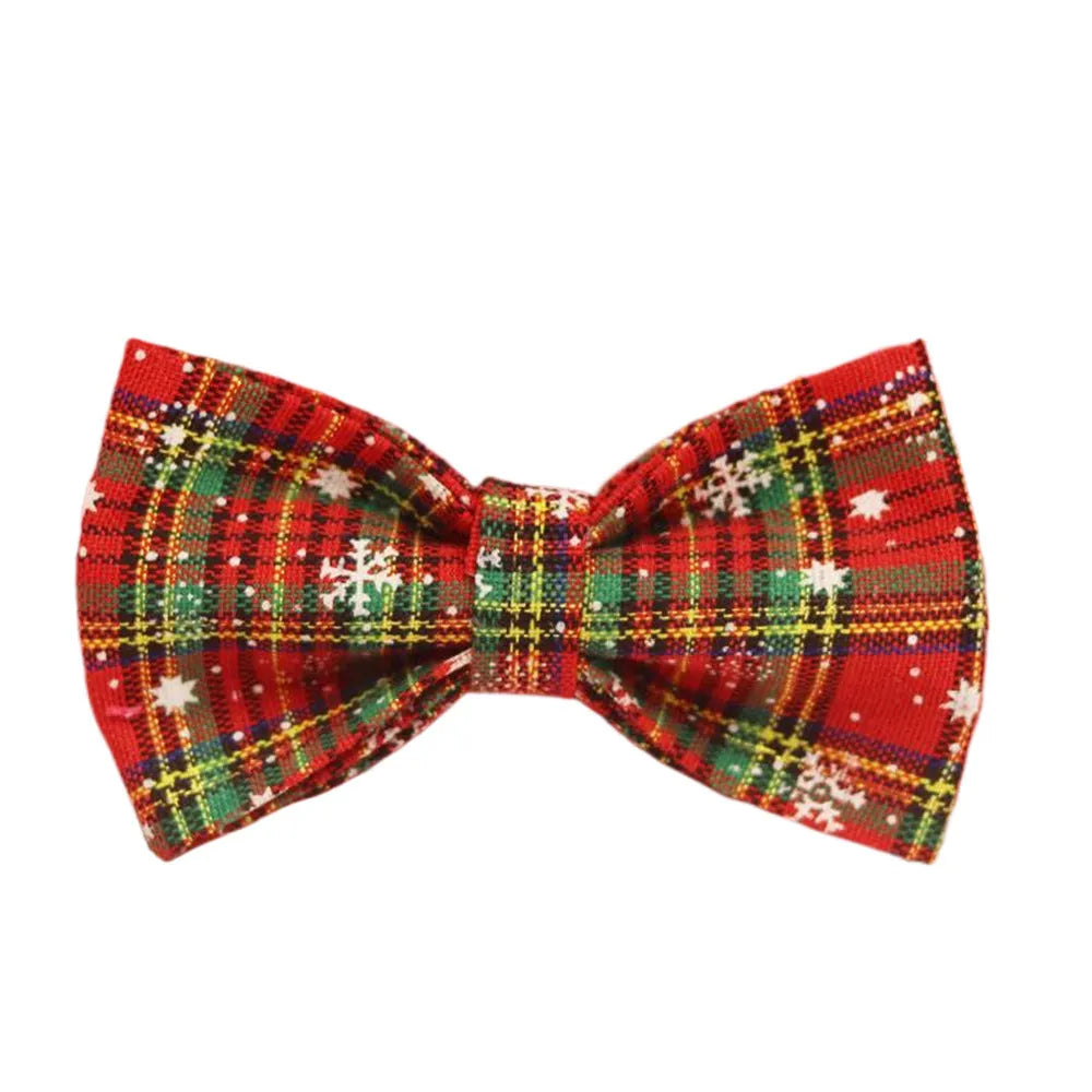 Red snowflake plaid dog collar and leash set with matching vest and decorative bow.