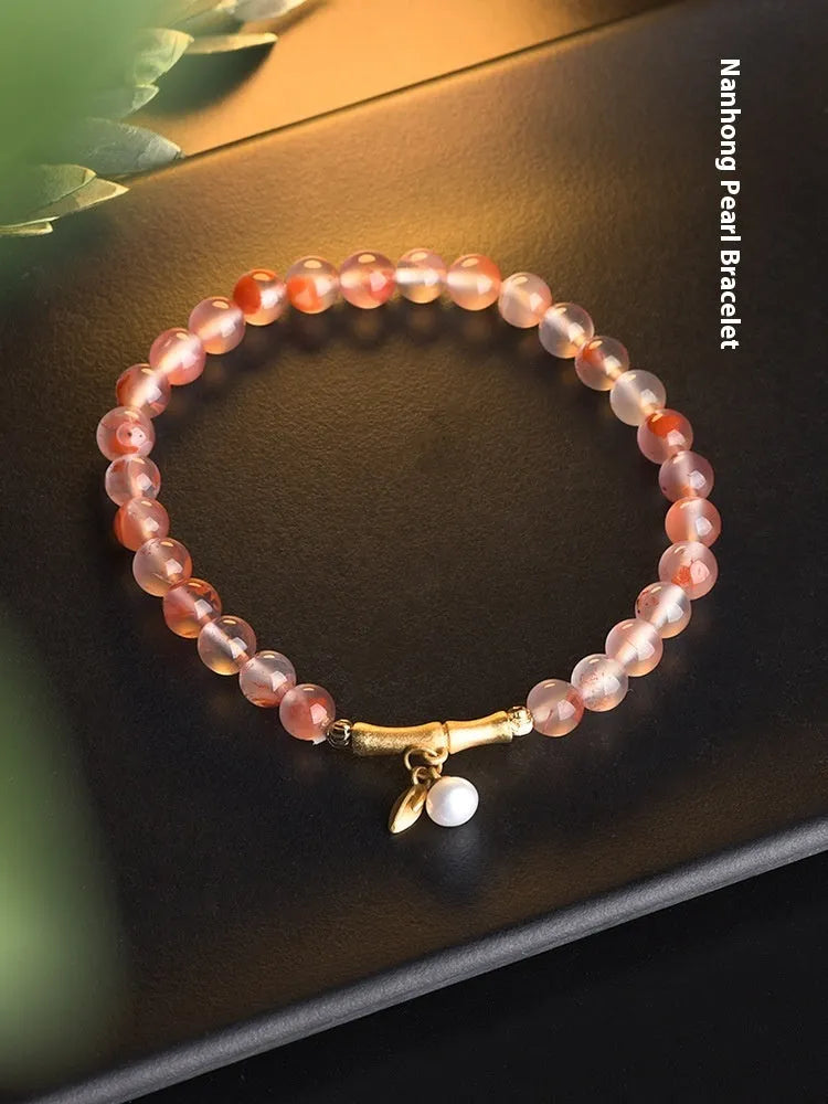 Ice float nanhong agate ethnic bracelet with bamboo joint links and flower decoration in hetian jade colour