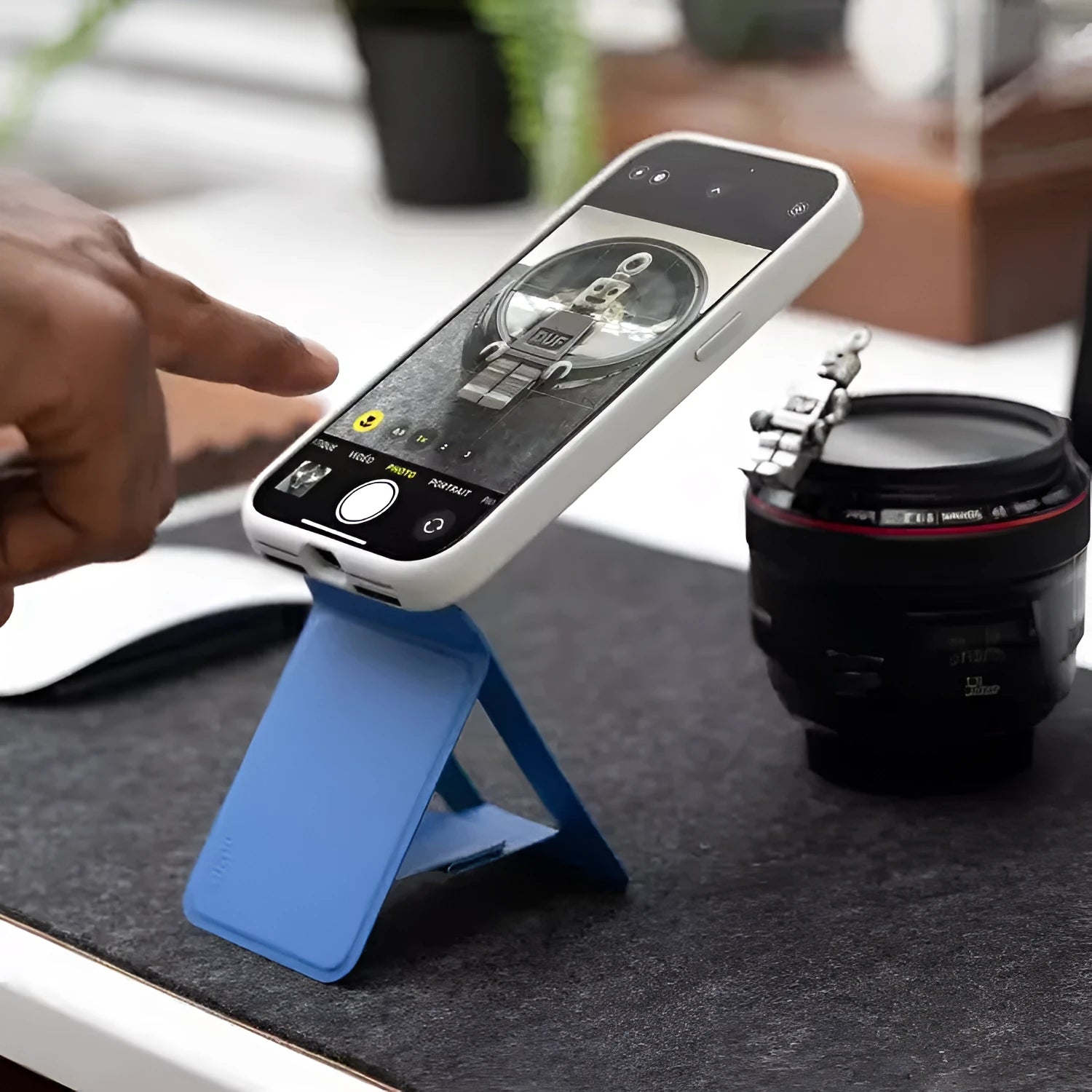 Slim black magnetic phone holder case with MOVAS leather texture on a magnetic car mount.