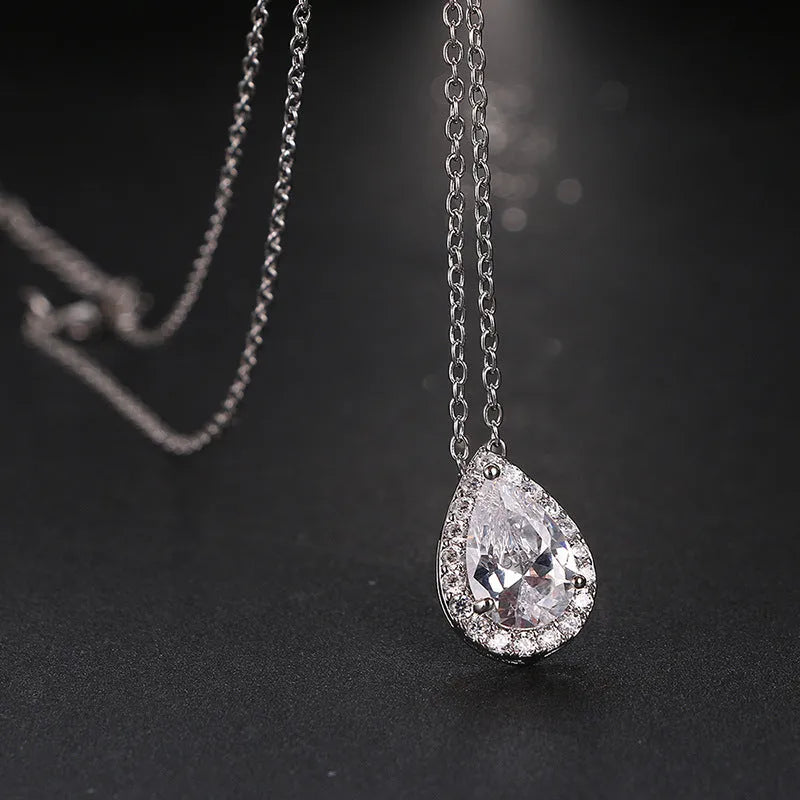 Women's water drop gemstone necklace and earrings jewellery set in copper and zircon, available in gold finish