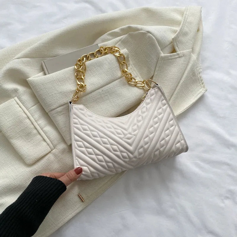 Brown pleated PU baguette shoulder bag showing its vertical square shape and chain strap.
