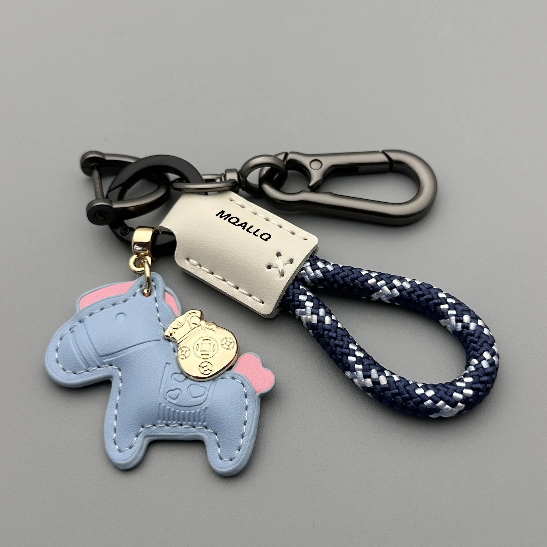 Handmade cowhide car key ring pendant with zinc alloy pony belt buckle charm and flanelle rope in various colours.