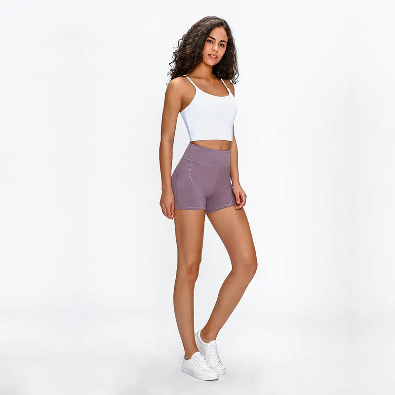 SHINBENE women's high waisted athletic shorts in black with two side pockets and cotton feel nylon spandex fabric