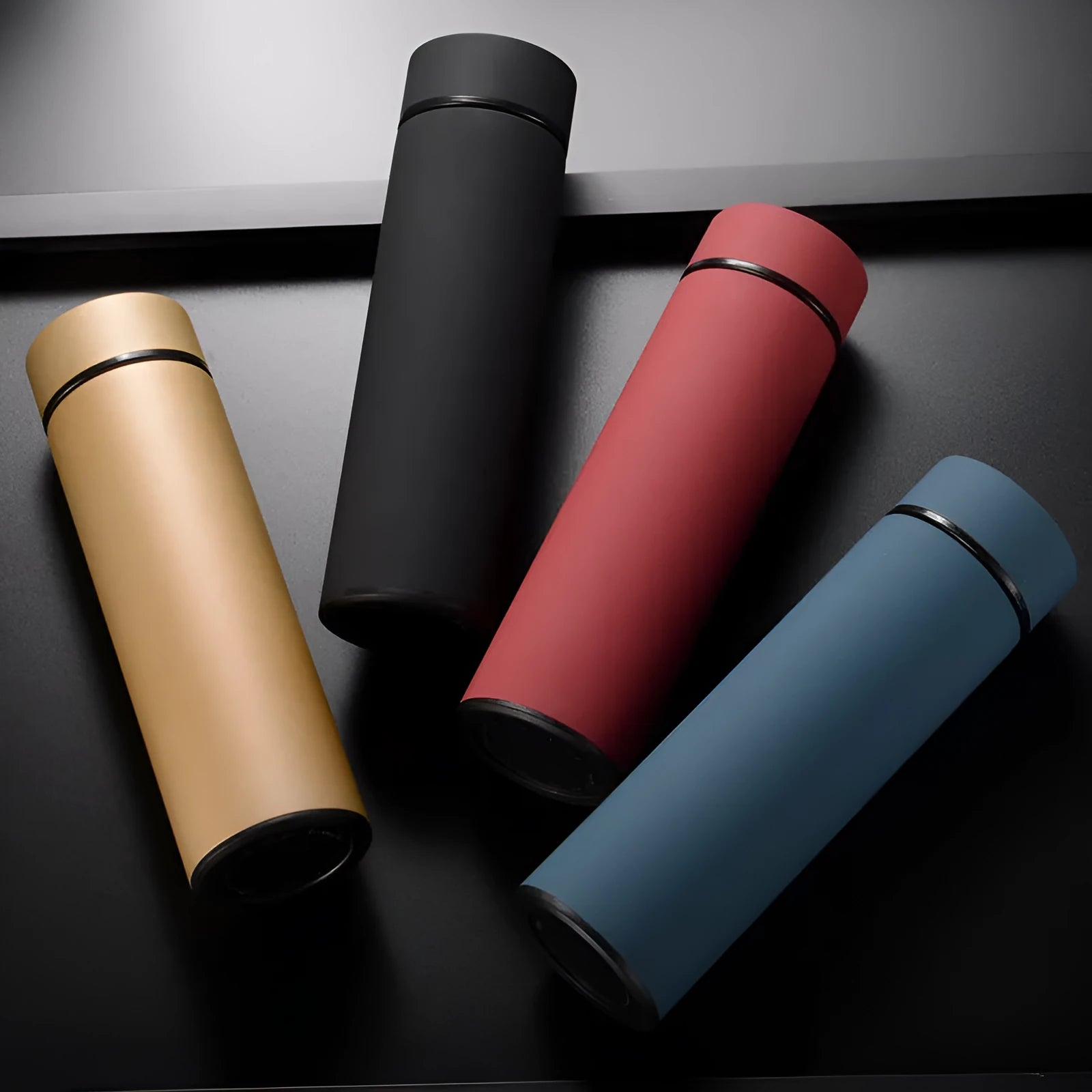 450ml stainless steel vacuum insulated water bottle in black, red, gold, and blue colours