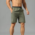 Men's grey loose ice silk quick-dry cropped pants showing mid-calf length and sportswear styling