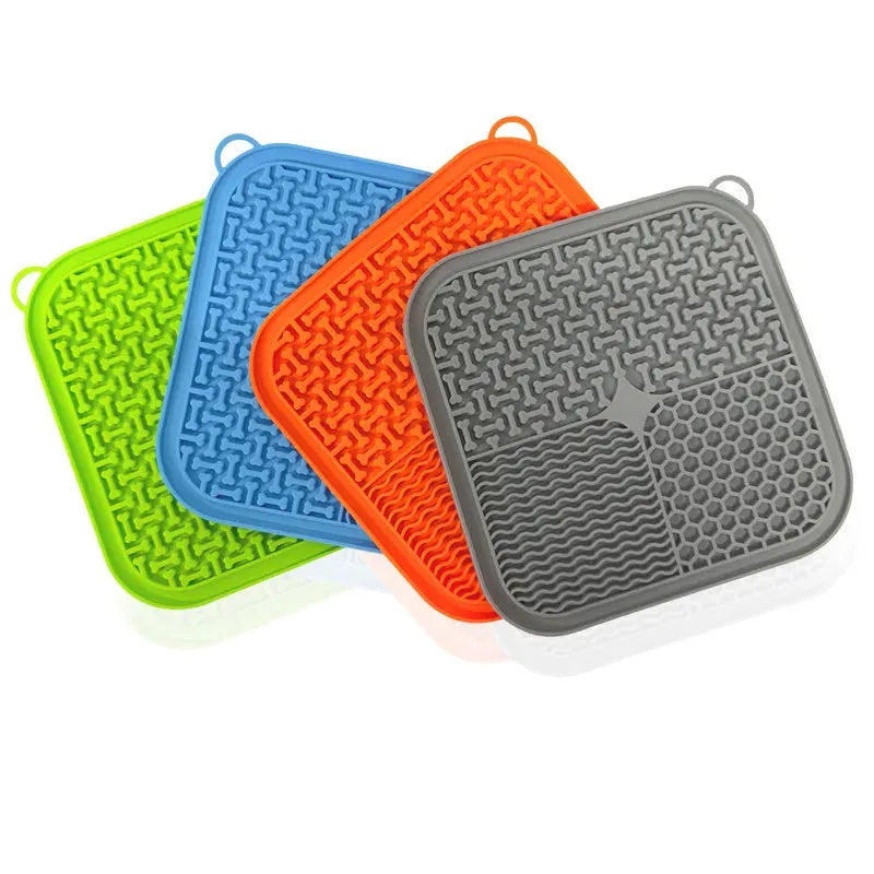 Blue silicone dog licking mat with suction cups on back, textured surface for slow feeding.