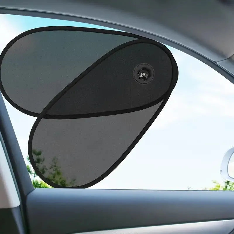 Black stretchy car side window sunshade for babies attached with suction cups.