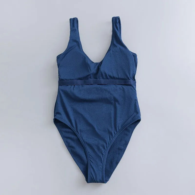 Navy blue women's one-piece swimsuit with triangle slimming design and removable chest pads