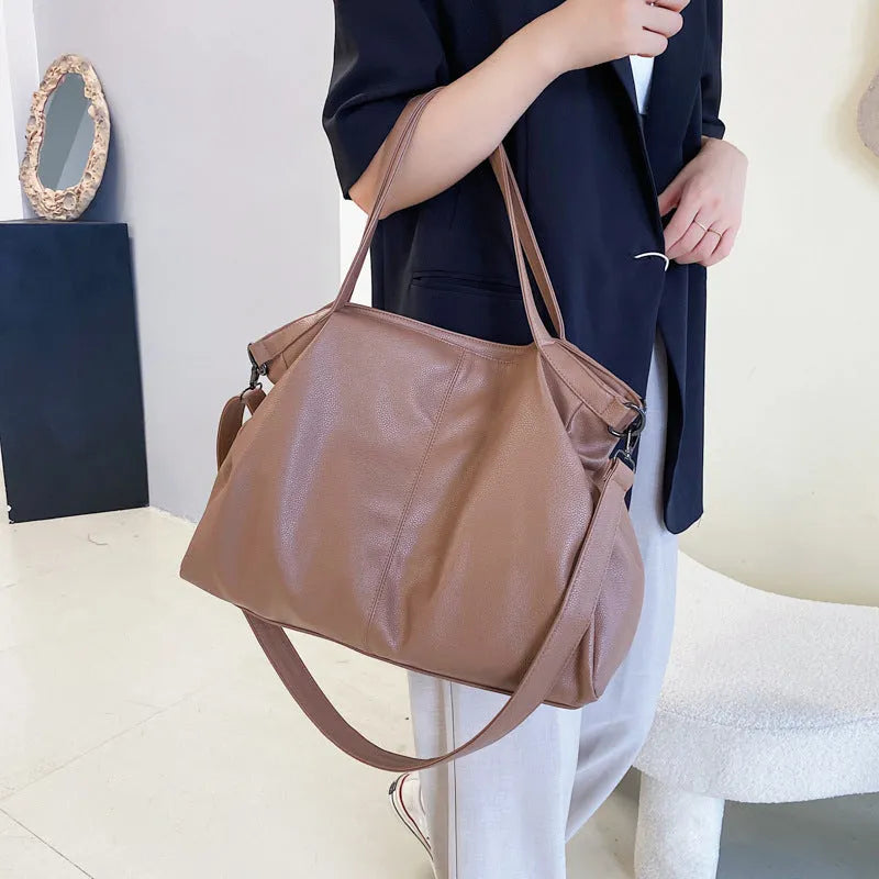 Large soft black PU messenger tote bag with shoulder strap and top zipper