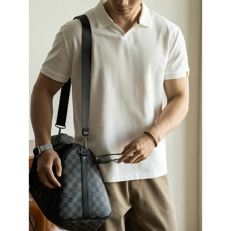 American-style short-sleeved polo shirt in blue on hanger showing regular fit and cotton blend fabric.