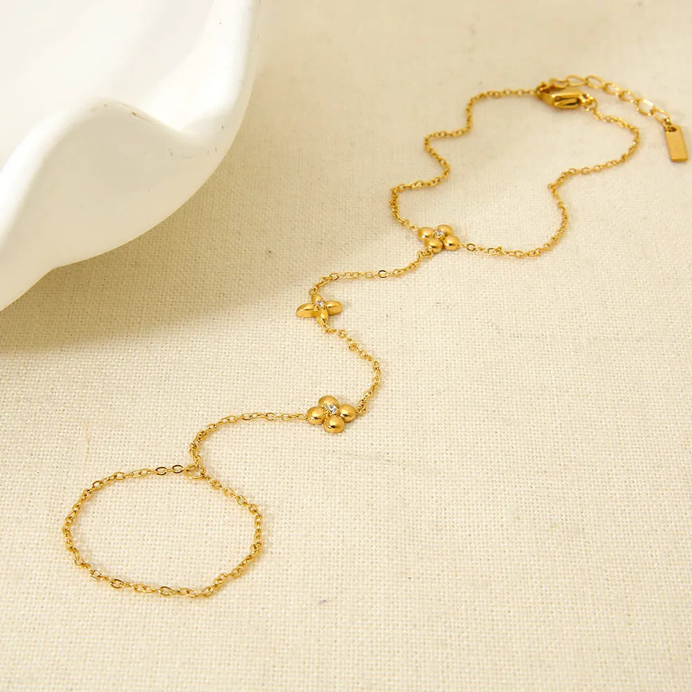 Gold-colour stainless steel women's bracelet with geometric flower and eight-pointed star design