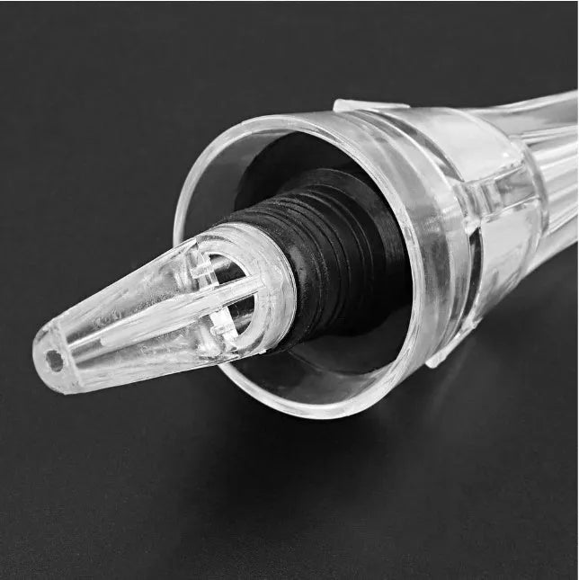 Compact clear acrylic wine aerator with a stainless steel filter inside, measuring 16cm.