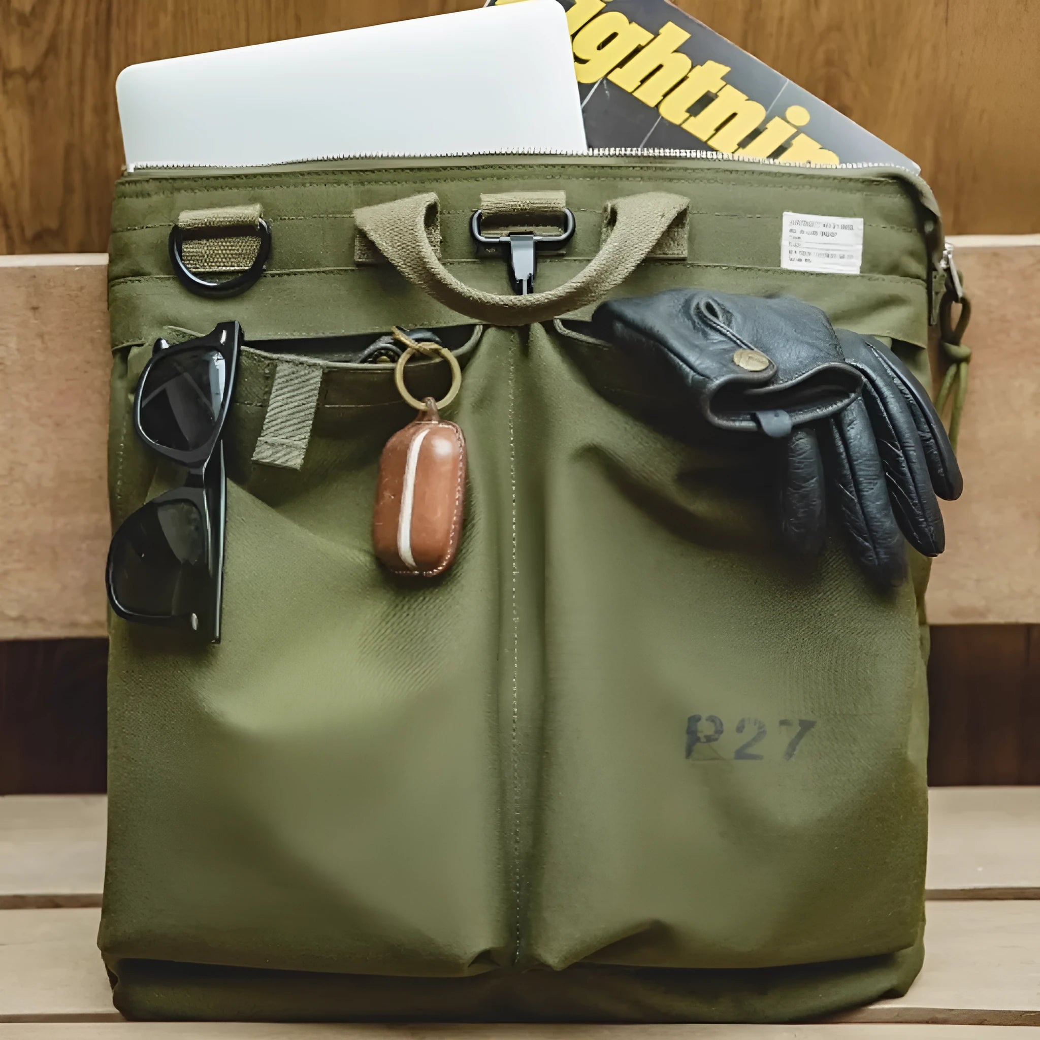Marden Tooling Helmet medium canvas messenger bag in charcoal black showing vertical square shape and shoulder strap