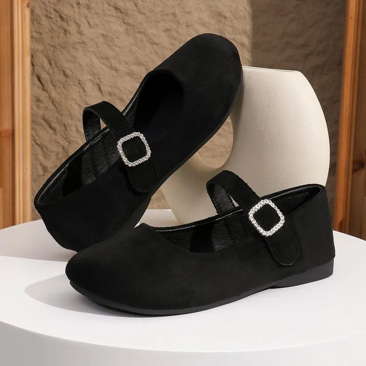 Black canvas fisherman shoes with flat rubber soles shown in adult sizes