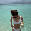 Women's solid colour bikini in orange, brief style, for swimming.