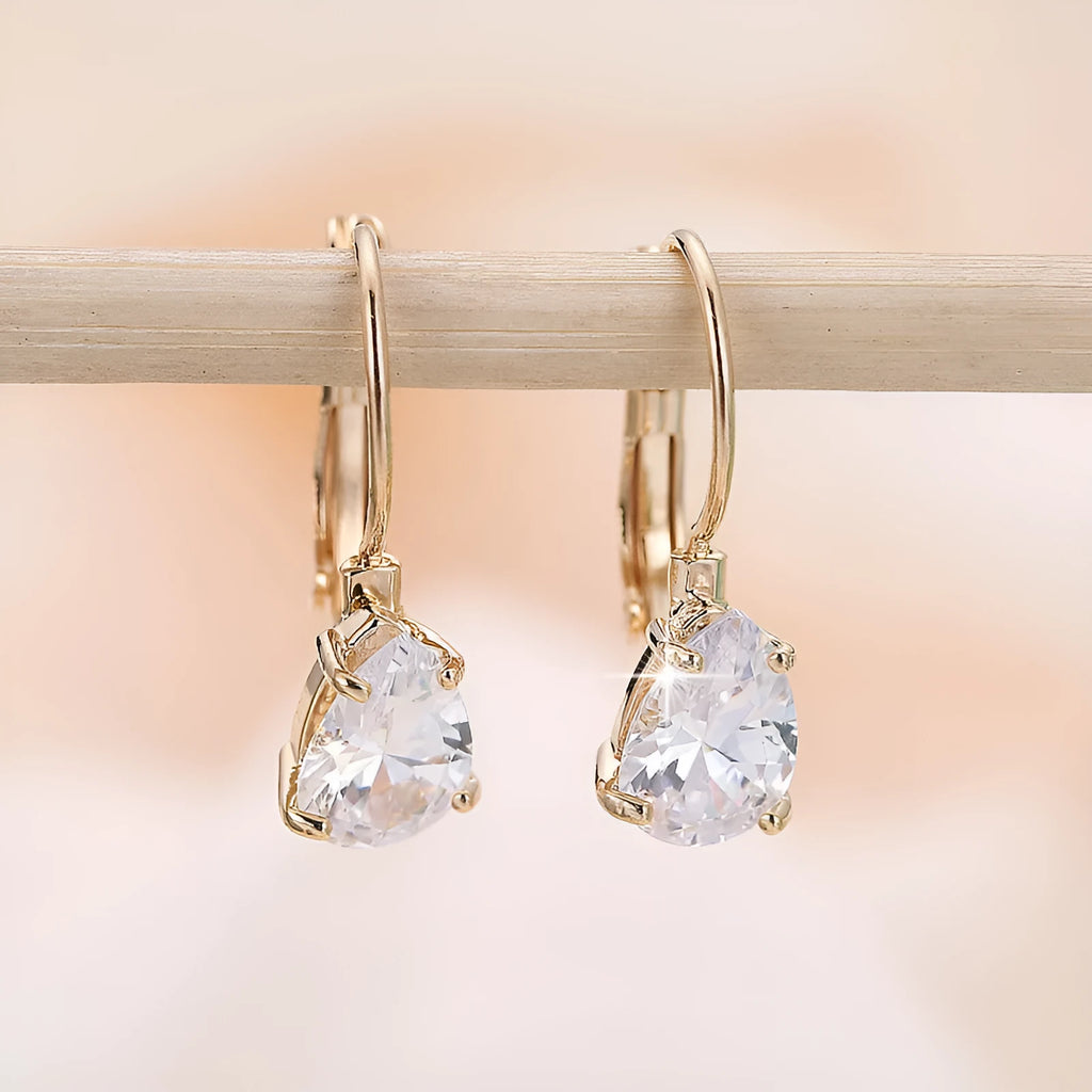 Gold and platinum drop-shaped women's metal earrings with a k-platinum inlaid gem
