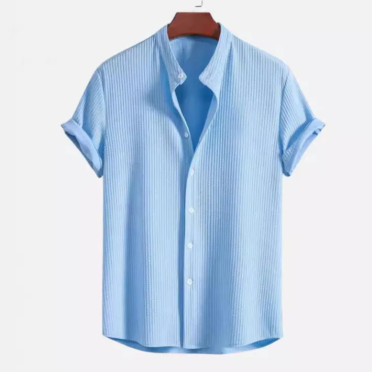 Men's loose fit short sleeve casual shirt in light blue, showing front view on a hanger.