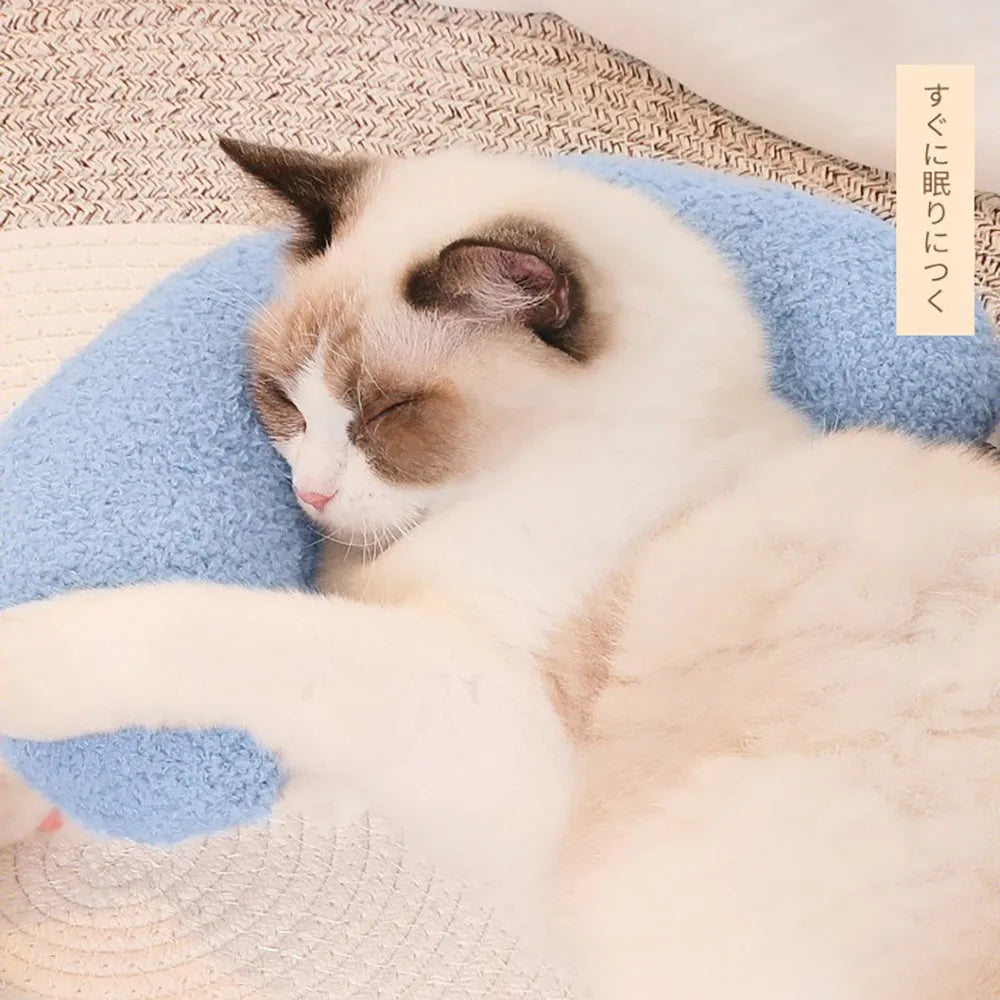 U-shaped blue cat pillow with adjustable neck collar on sofa
