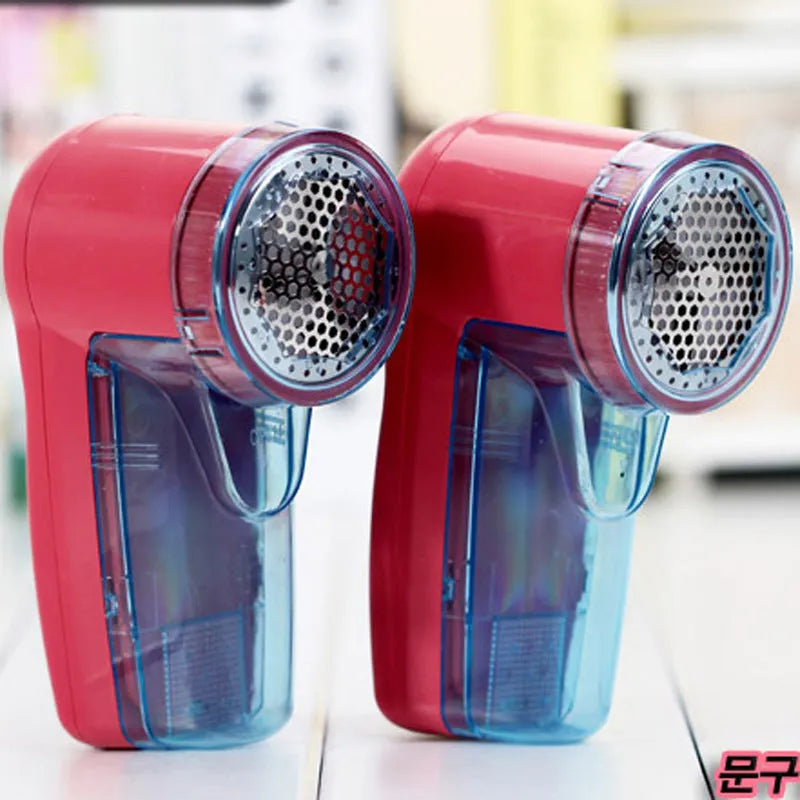 Portable electric clothes lint remover and pill shaver unit with compact white body.