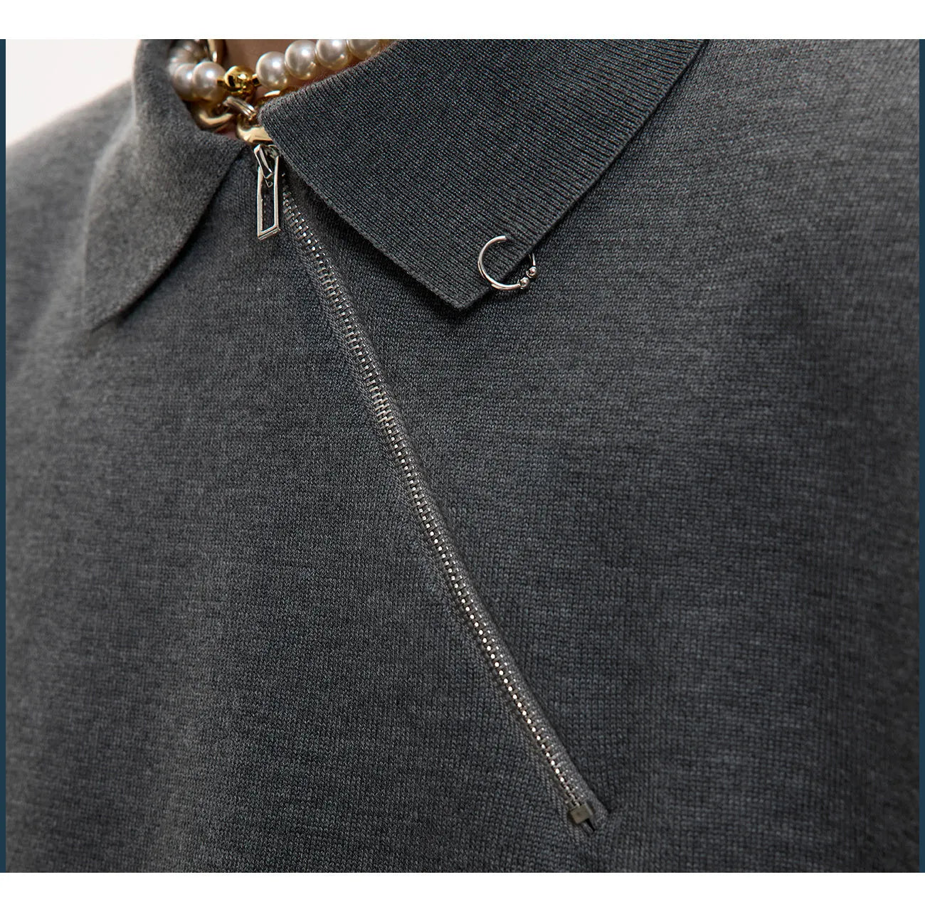 Men's slim-fit black knitted polo shirt with an oblique diagonal zip and short sleeves.