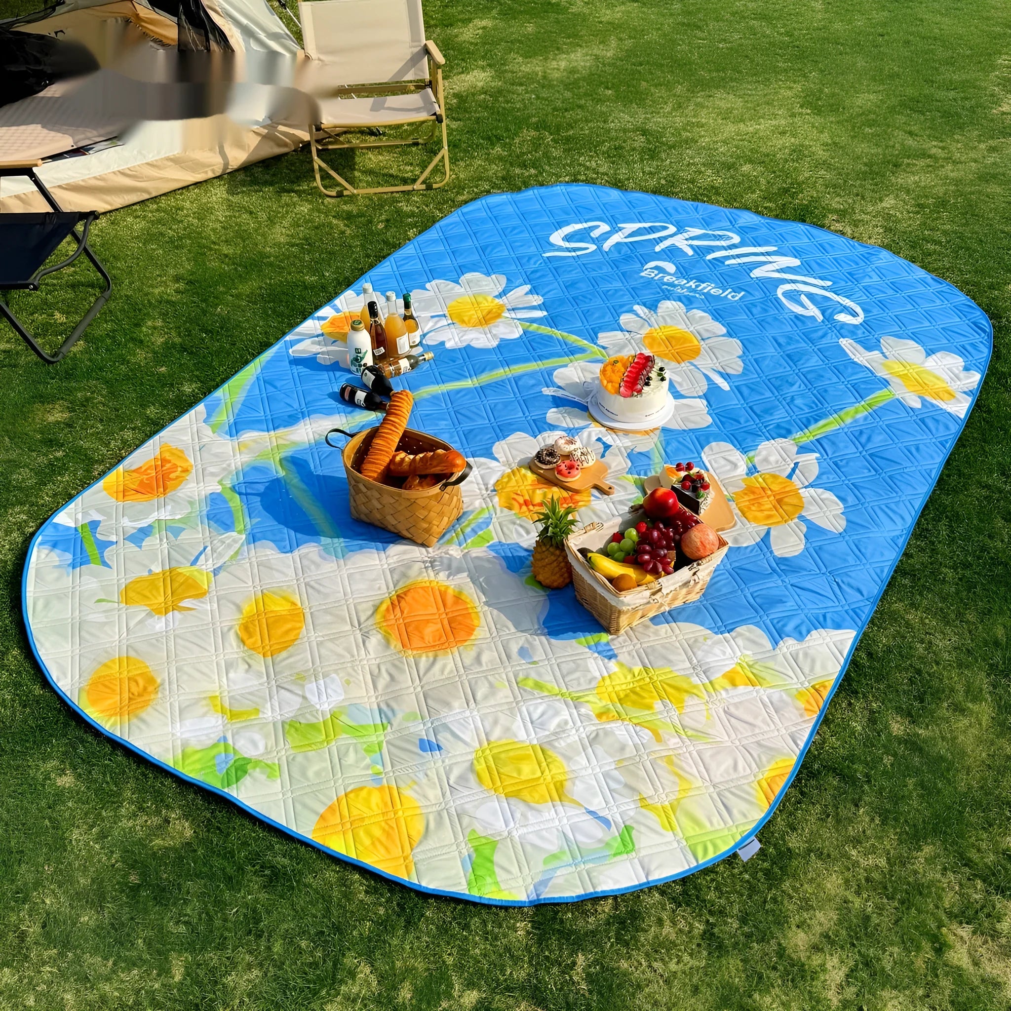 Waterproof ultrasonic thickening outdoor picnic mat in a seasonal colour, laid flat on grass.