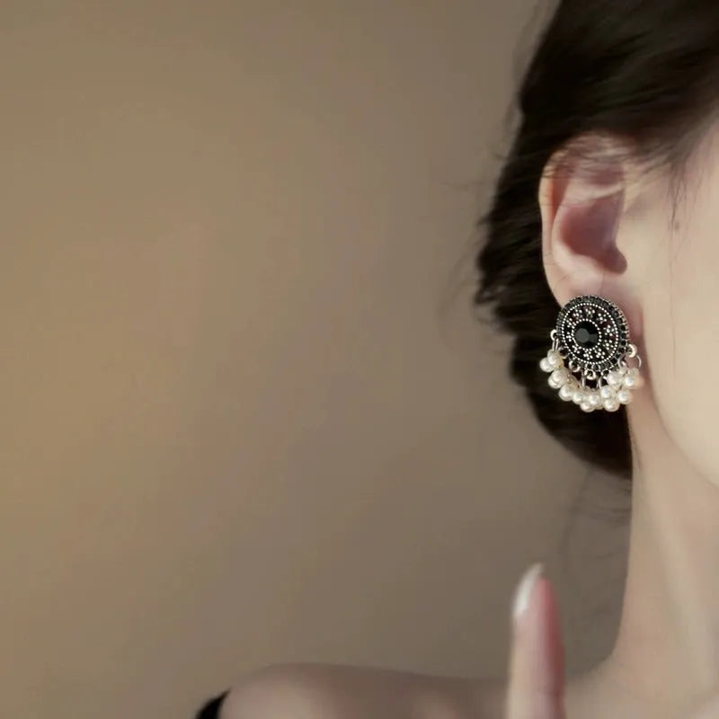 Pair of Miao maiden pearl earrings in round geometric shape with electroplating finish